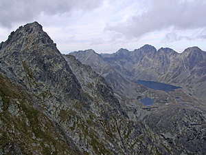 A chain of high mountains surrounding two mountain lakes